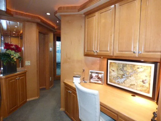 Slide: The Image of Luxurious wooden interior with desk, cabinets, and decorative map in a 2007 Fantasy model. - 11