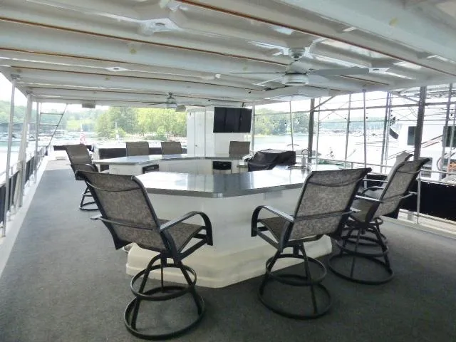 Slide: The Image of Luxurious yacht deck with seating, table, and TV, Fantasy 19x112 model, 2007. - 18