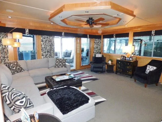 Slide: The Image of Luxurious houseboat interior with modern decor, featuring a spacious living area and stylish furnishings. - 2