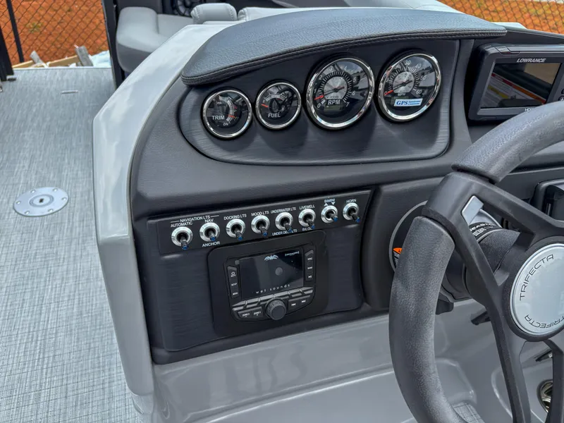Slide: The Image of Control panel of 2025 Trifecta CS 22UL 3.0 boat with gauges and switches. - 10