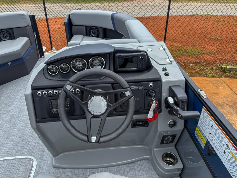 Slide: The Image of 2025 Trifecta CS 22UL 3.0 boat dashboard with steering wheel and control panel. - 11