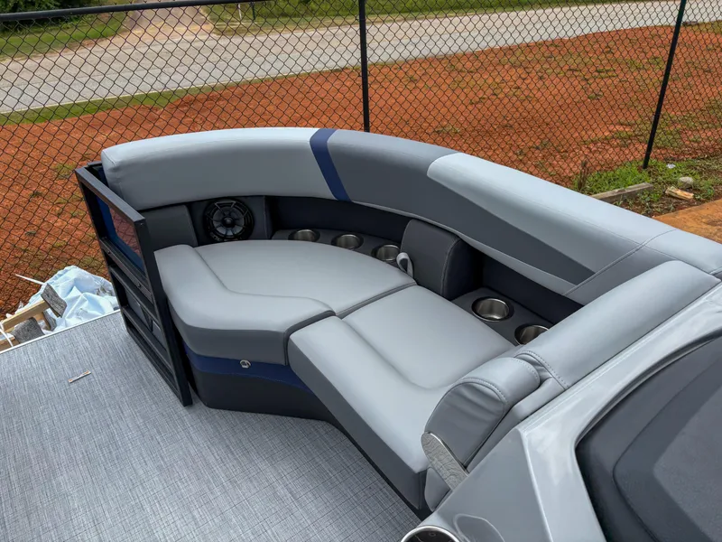 Slide: The Image of 2025 Trifecta CS 22UL 3.0 pontoon boat interior with gray seating and cup holders. - 12