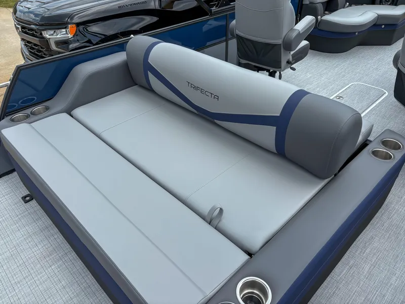 Slide: The Image of 2025 Trifecta CS 22UL 3.0 boat interior with gray seating and cup holders. - 3