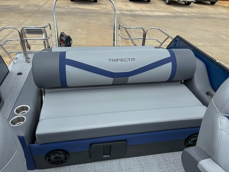 Slide: The Image of 2025 Trifecta CS 22UL 3.0 boat interior with gray seating and cup holders. - 4