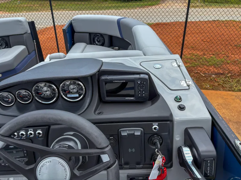 Slide: The Image of Trifecta CS 22UL 3.0 boat dashboard with gauges and navigation system, 2025 model. - 9