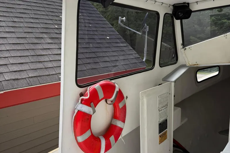 Slide: The Image of Interior of a 1998 Crowley-Beal 32 boat with a life preserver. - 20