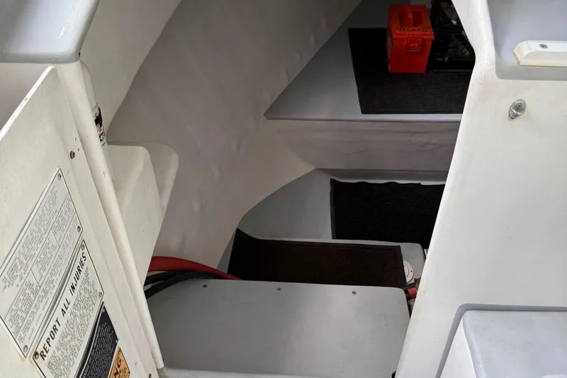 Slide: The Image of Interior of a 1998 Crowley-Beal 32 boat showing steps and storage area. - 22