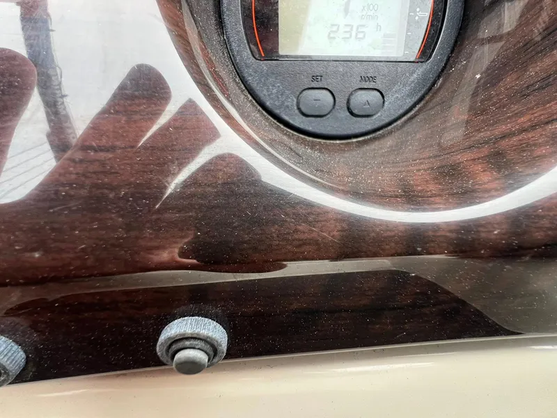 Slide: The Image of Control panel of a 2018 Bennington SX 23 boat with digital display and buttons. - 11