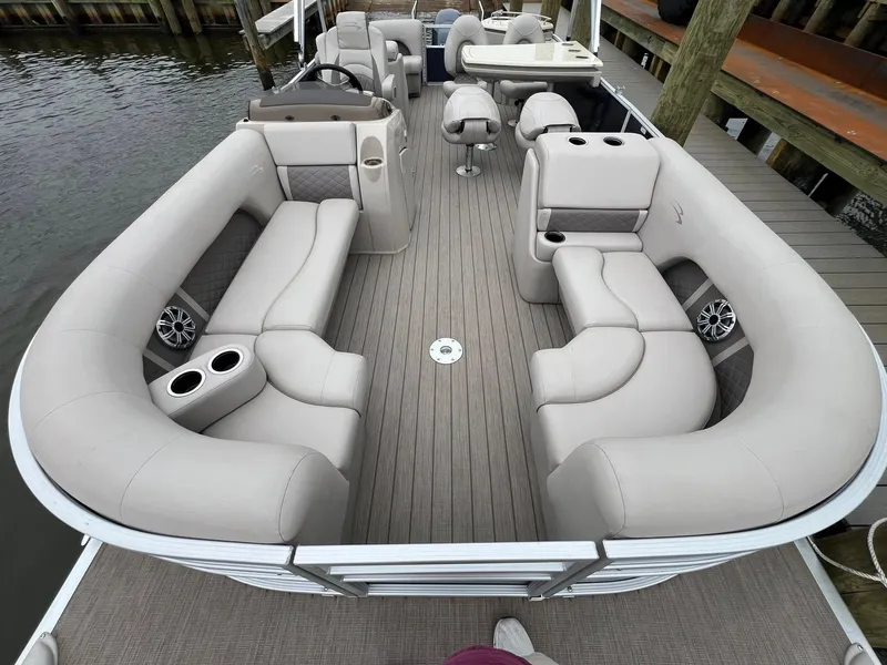 Slide: The Image of 2018 Bennington SX 23 pontoon boat with spacious seating and modern design. - 8