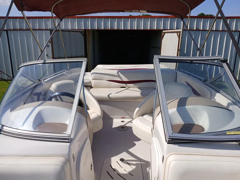 Slide: The Image of 2008 Tahoe Q7i boat interior with white seating and open windshield. - 13