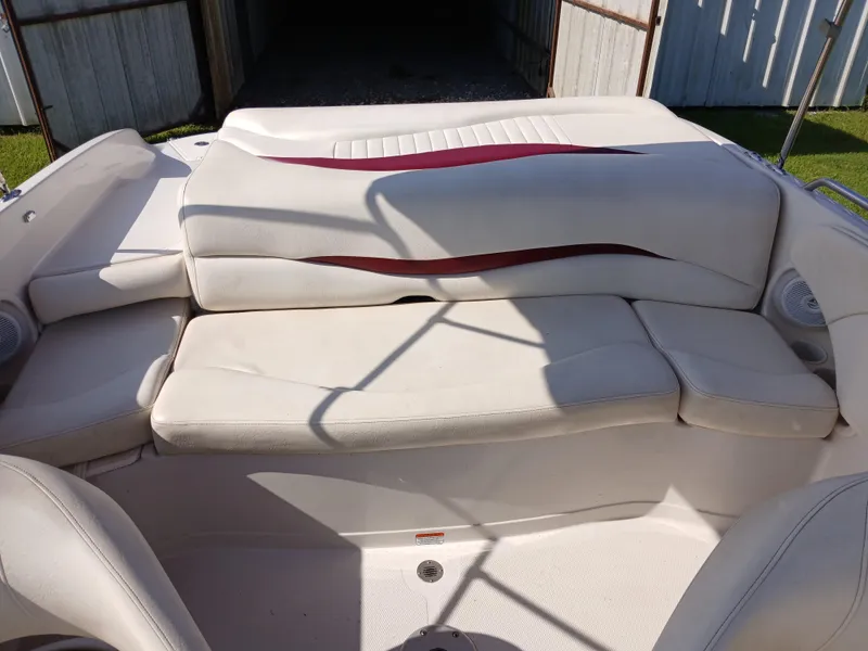 Slide: The Image of 2008 Tahoe Q7i boat interior with white and red cushioned seating. - 16