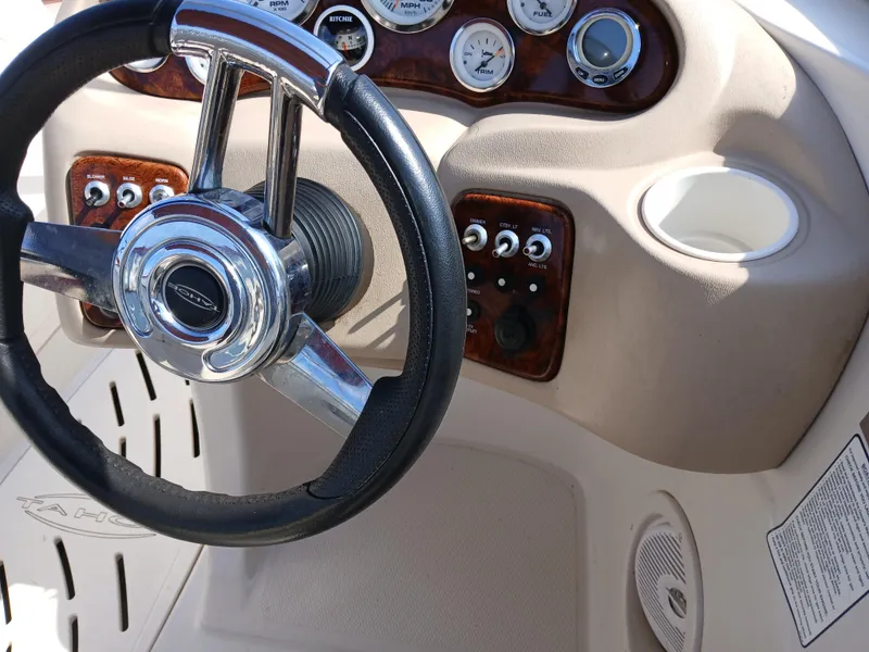 Slide: The Image of Steering wheel and dashboard of a 2008 Tahoe Q7i boat. - 20