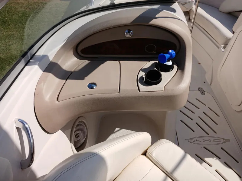 Slide: The Image of 2008 Tahoe Q7i boat interior with cup holders and seating area. - 21