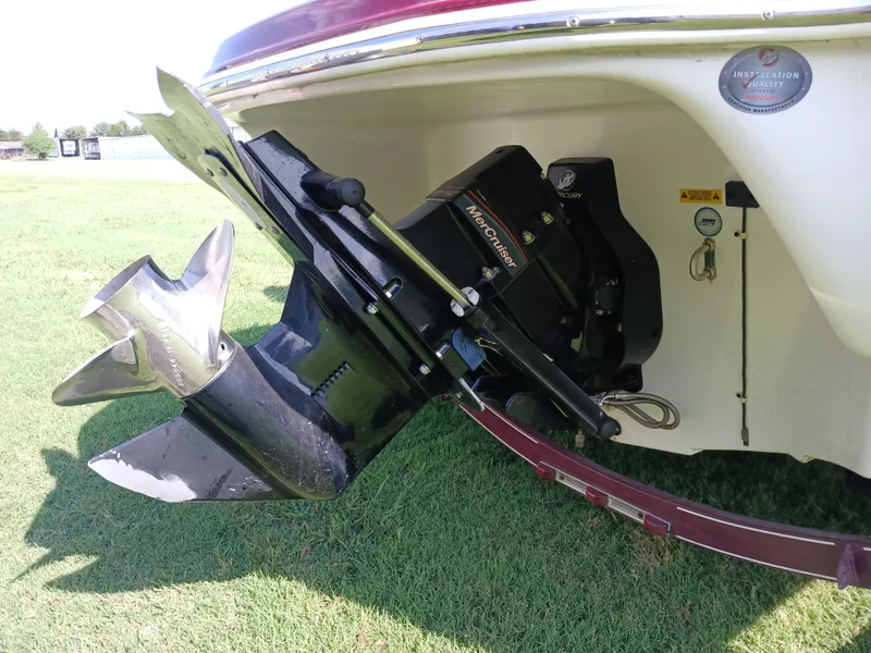 Slide: The Image of 2008 Tahoe Q7i boat with MerCruiser outdrive on grassy field. - 8