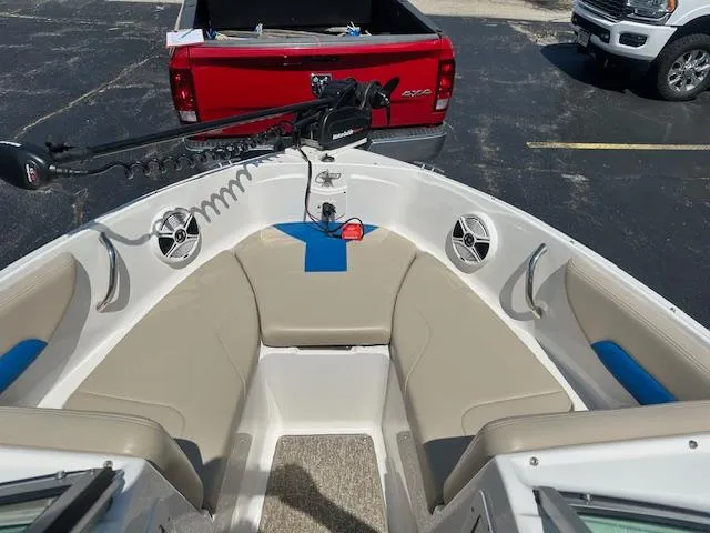 Slide: The Image of 2018 Chaparral 19 H2O Ski & Fish boat interior with seating and speakers. - 11