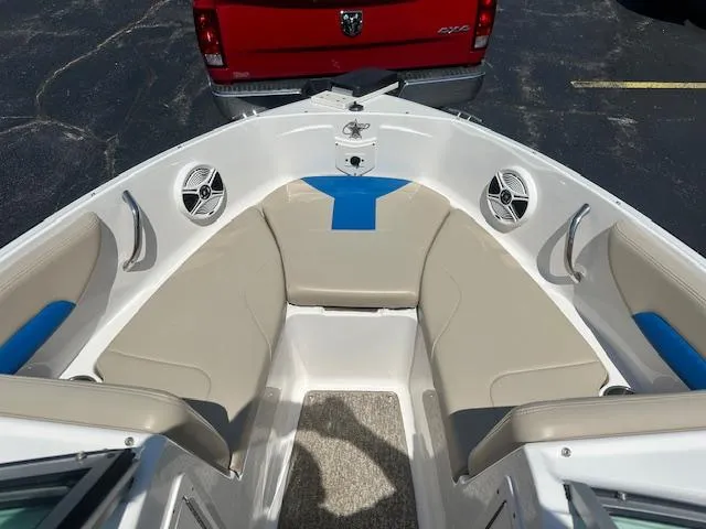 Slide: The Image of 2018 Chaparral 19 H2O Ski & Fish boat interior with beige and blue seating. - 13