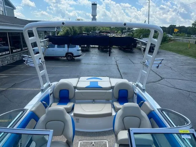 Slide: The Image of 2018 Chaparral 19 H2O Ski & Fish boat with seating and tower, parked outdoors. - 15
