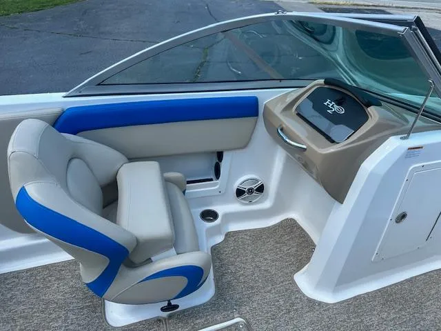 Slide: The Image of 2018 Chaparral 19 H2O Ski & Fish boat interior with blue and beige seating. - 16