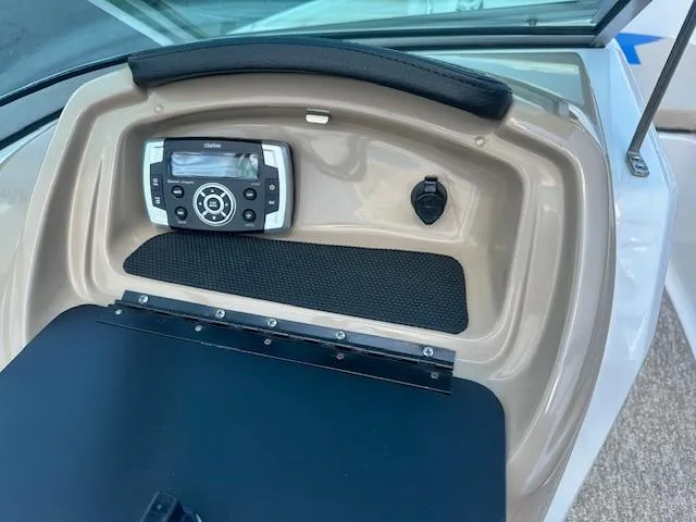 Slide: The Image of 2018 Chaparral 19 H2O Ski & Fish dashboard with stereo system and storage compartment. - 18
