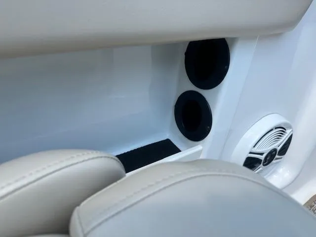 Slide: The Image of Interior of 2018 Chaparral 19 H2O Ski & Fish boat with cup holders and speaker. - 19