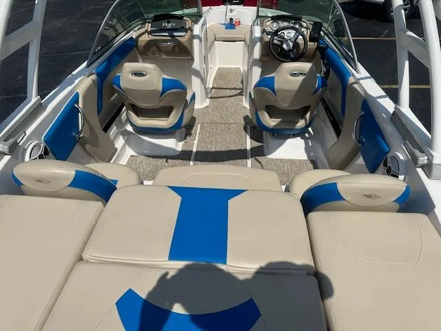 Slide: The Image of 2018 Chaparral 19 H2O Ski & Fish boat interior with beige and blue seating. - 5
