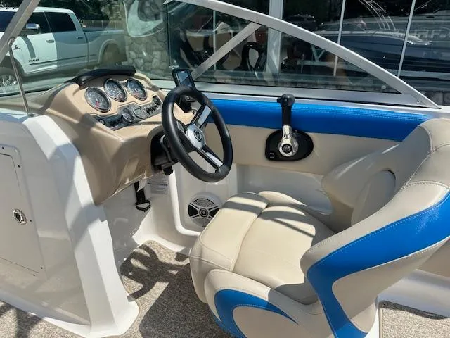 Slide: The Image of 2018 Chaparral 19 H2O Ski & Fish boat interior with steering wheel and dashboard. - 8