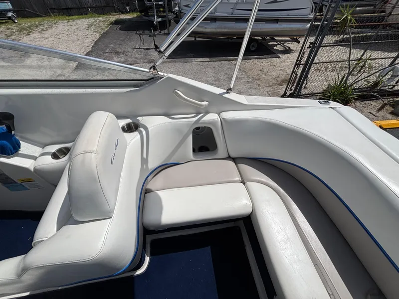 Slide: The Image of 1996 Chris-Craft 25 Concept boat interior with white seating and blue accents. - 10
