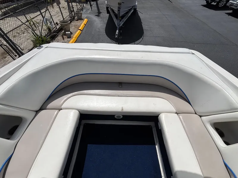 Slide: The Image of 1996 Chris-Craft 25 Concept boat interior with white and beige seating. - 11