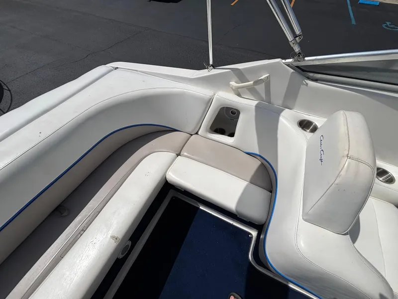Slide: The Image of Interior seating of a 1996 Chris-Craft 25 Concept boat with white upholstery. - 12