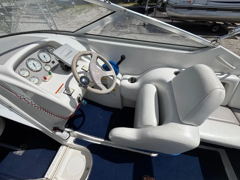 Slide: The Image of 1996 Chris-Craft 25 Concept boat interior with steering wheel and dashboard gauges. - 14