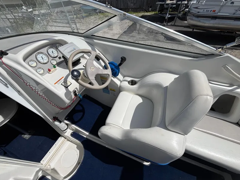 Slide: The Image of Interior of a 1996 Chris-Craft 25 Concept boat showing steering wheel and dashboard controls. - 15