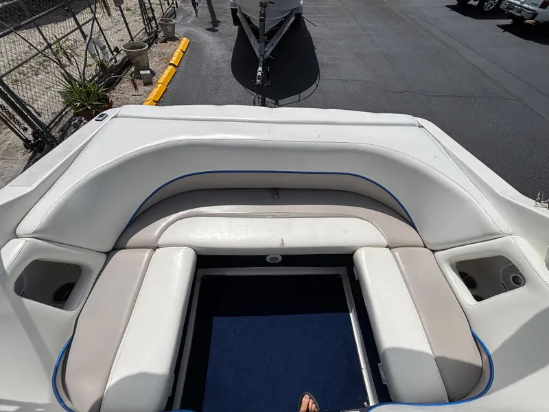 Slide: The Image of 1996 Chris-Craft 25 Concept boat interior with white seating and blue accents. - 18