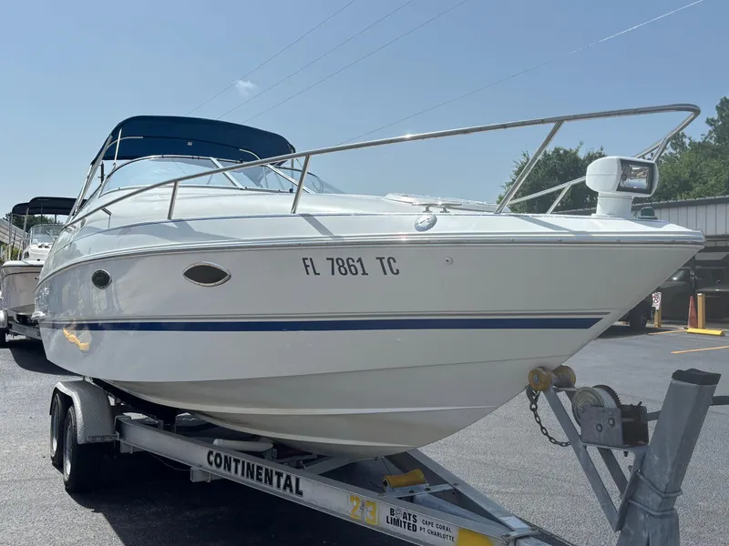 Slide: The Image of 1996 Chris-Craft 25 Concept boat on trailer, parked outdoors. - 3