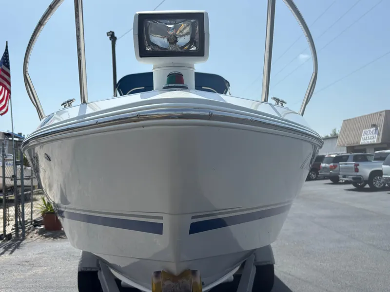 Slide: The Image of 1996 Chris-Craft 25 Concept boat front view in a parking lot. - 5