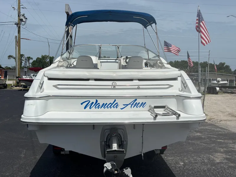 Slide: The Image of 1996 Chris-Craft 25 Concept boat named "Wanda Ann" with American flags in the background. - 7