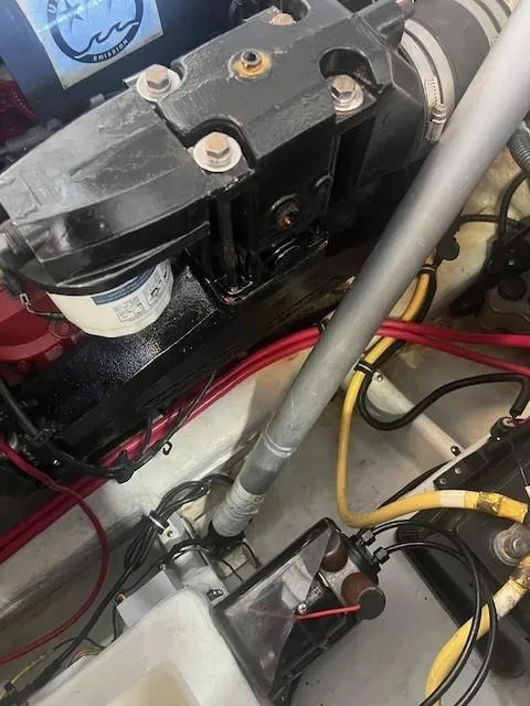 Slide: The Image of Engine compartment of a 2004 Chris-Craft Corsair 25 with visible wiring and components. - 23