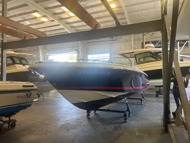 Slide: The Image of 2004 Chris-Craft Corsair 25 boat in indoor storage facility. - 4