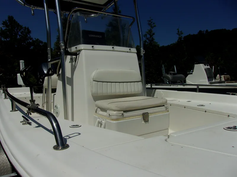 Slide: The Image of 2011 Tidewater 2100 Bay Max boat interior with seating and console. - 11