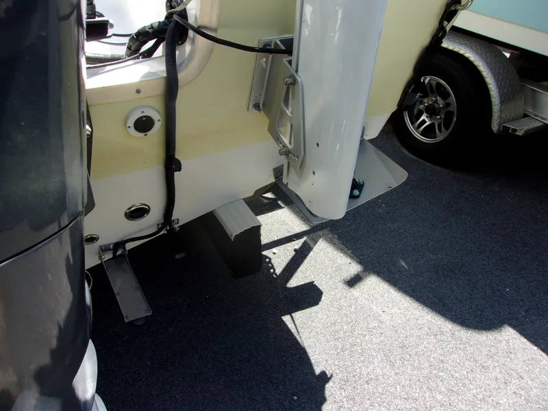Slide: The Image of Rear view of a 2011 Tidewater 2100 Bay Max boat with motor and trailer. - 3