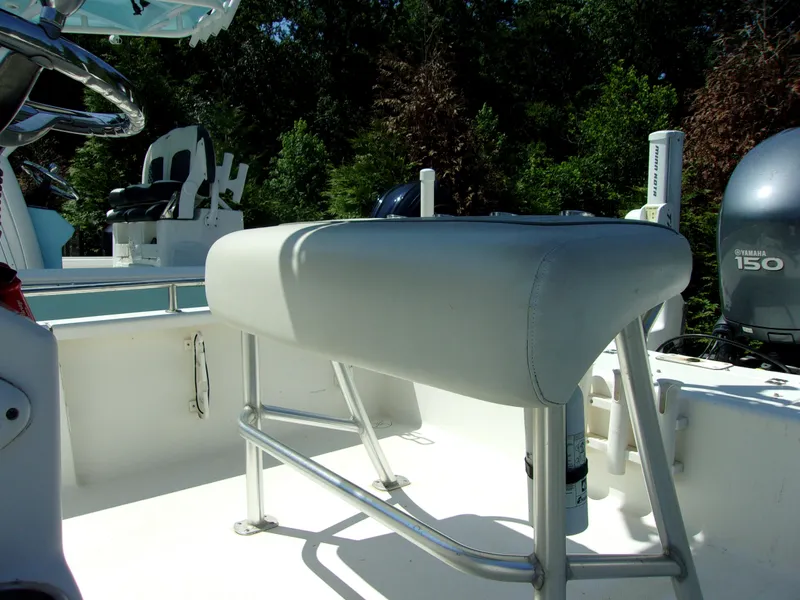 Slide: The Image of 2011 Tidewater 2100 Bay Max boat interior with seating and Yamaha 150 engine. - 8