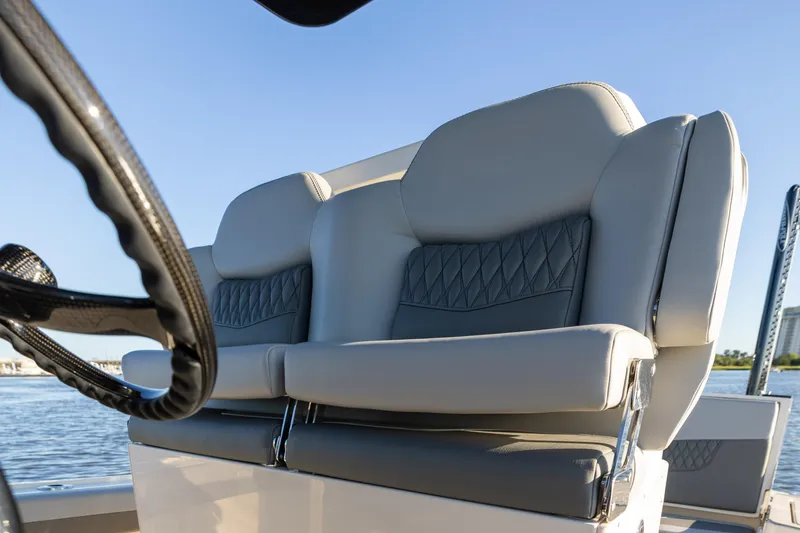 Slide: The Image of Luxury seating on 2026 Scout 281 X Signature Edition boat, with elegant design and waterfront view. - 14