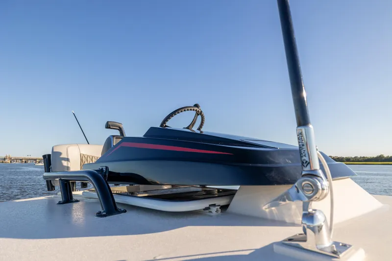 Slide: The Image of 2026 Scout 281 X Signature Edition boat on water, showcasing sleek design and modern features. - 19