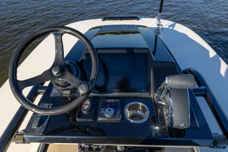 Slide: The Image of Steering console of 2026 Scout 281 X Signature Edition boat with modern controls. - 21
