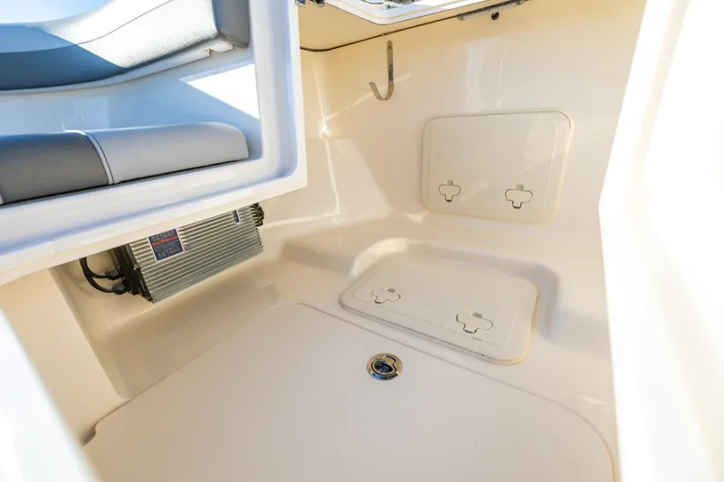 Slide: The Image of Interior of 2026 Scout 281 X Signature Edition boat, featuring storage compartments. - 29