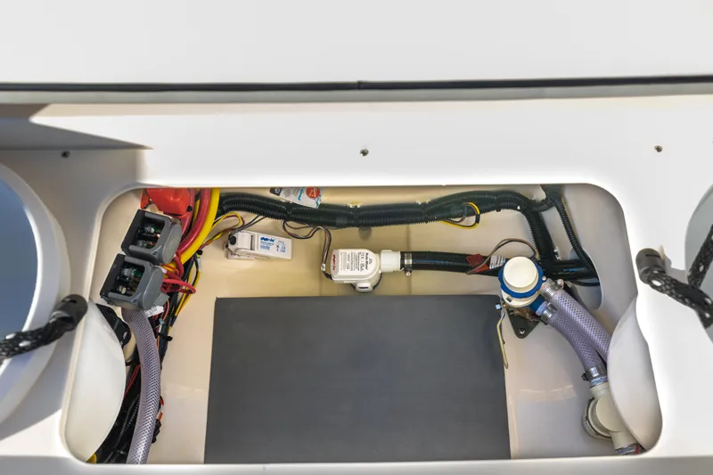Slide: The Image of 2026 Scout 281 X Signature Edition boat wiring and plumbing compartment. - 30