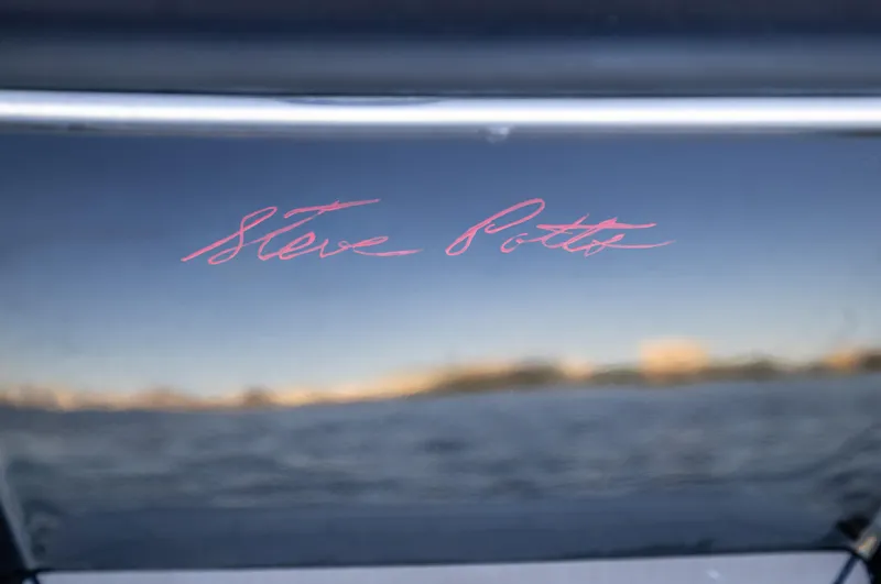 Slide: The Image of 2026 Scout 281 X Signature Edition with reflective water background. - 32