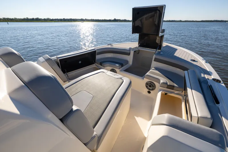 Slide: The Image of 2026 Scout 281 X Signature Edition boat interior with luxurious seating on calm water. - 8
