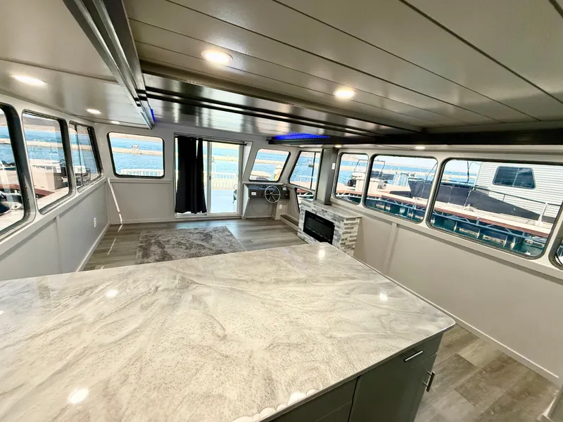 Slide: The Image of Interior of 1987 Three Buoys 5014 houseboat with modern design and large windows. - 10