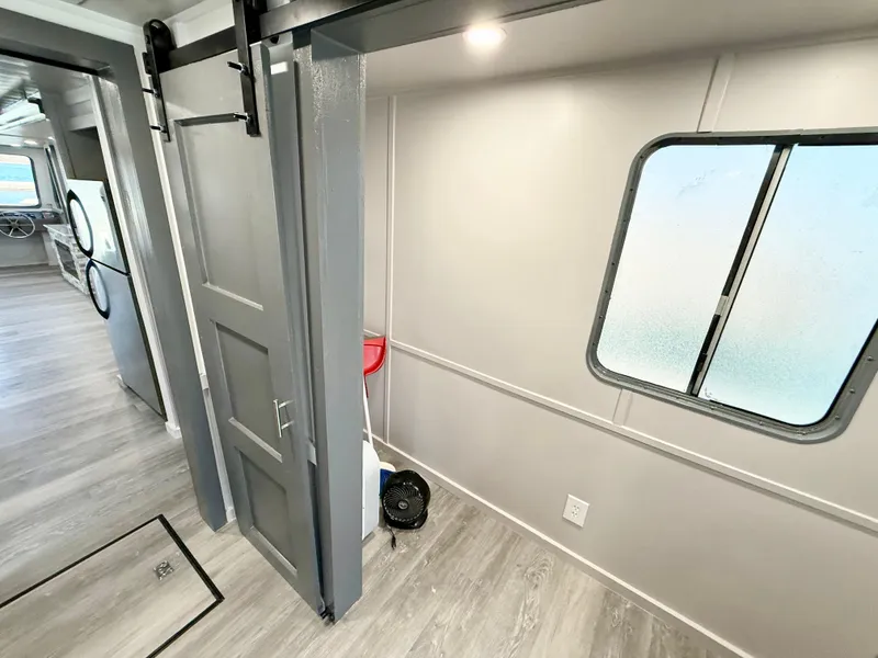 Slide: The Image of Interior of 1987 Three Buoys 5014 boat with modern decor and sliding door. - 14