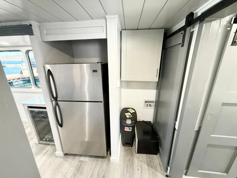 Slide: The Image of Modern kitchen area in 1987 Three Buoys 5014 boat with stainless steel appliances. - 18